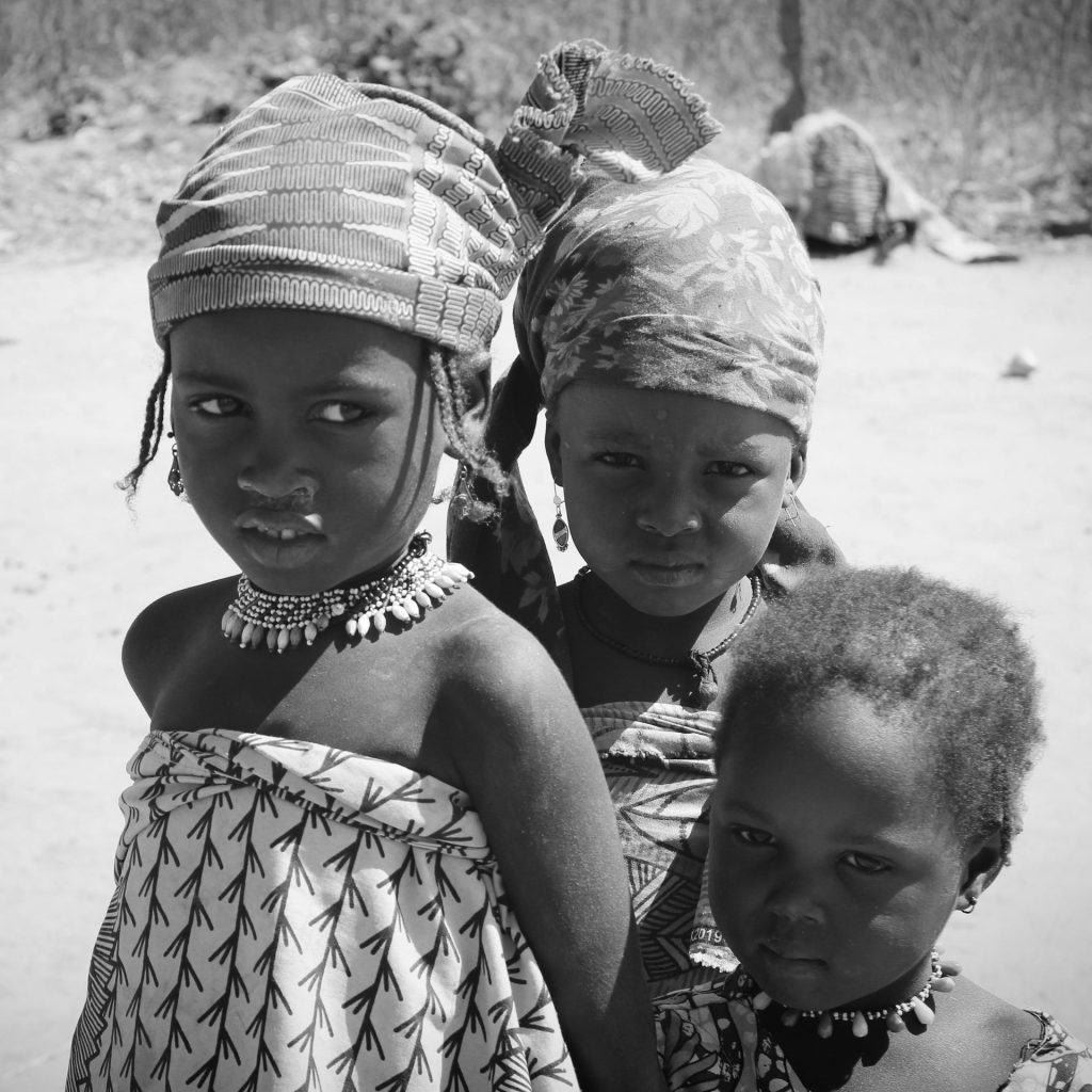 a group of young girls standing next to each other
